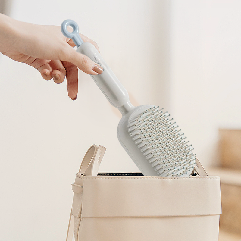 Brosse à cheveux portable à coussin d’air