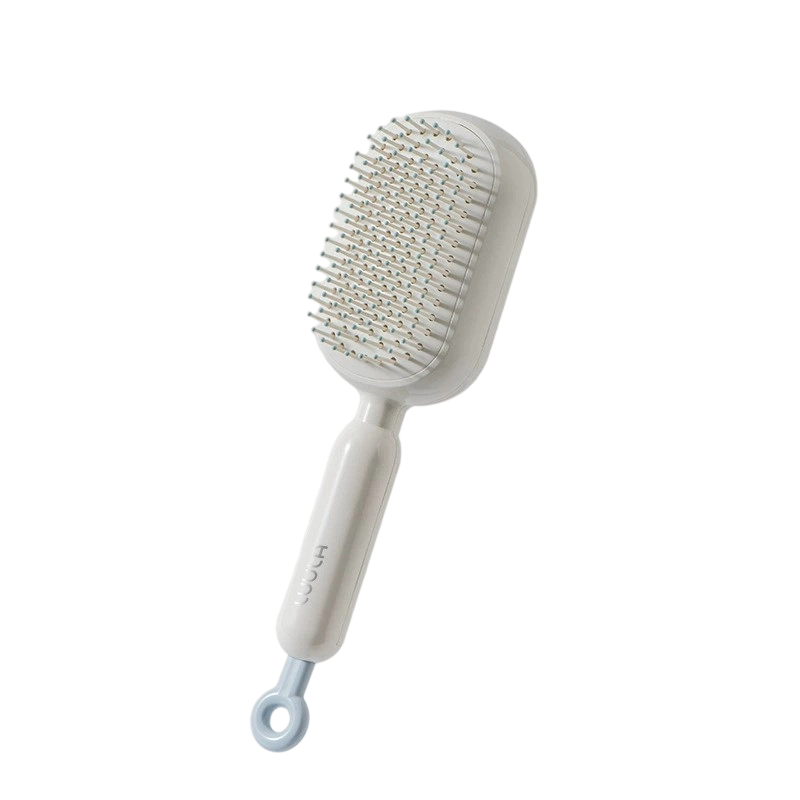 Brosse à cheveux portable à coussin d’air